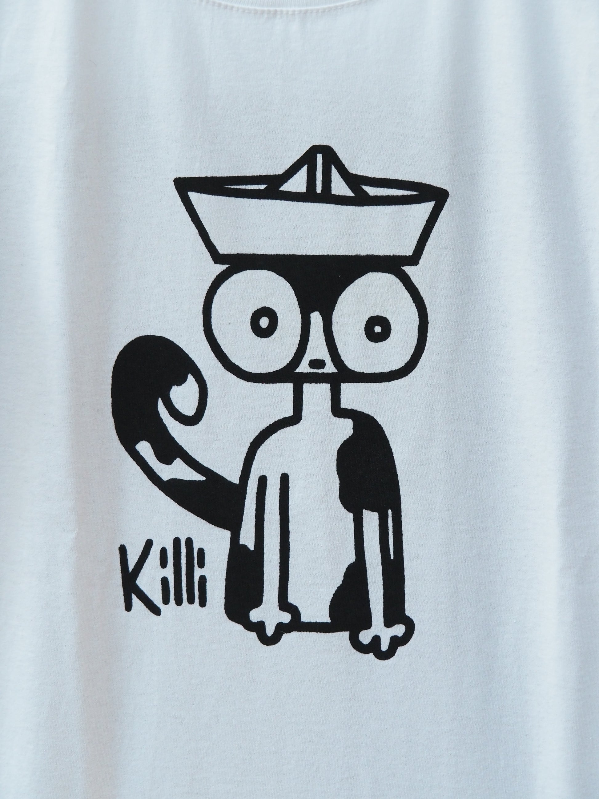 Black outlines of a cat wearing a paper hat on a white background