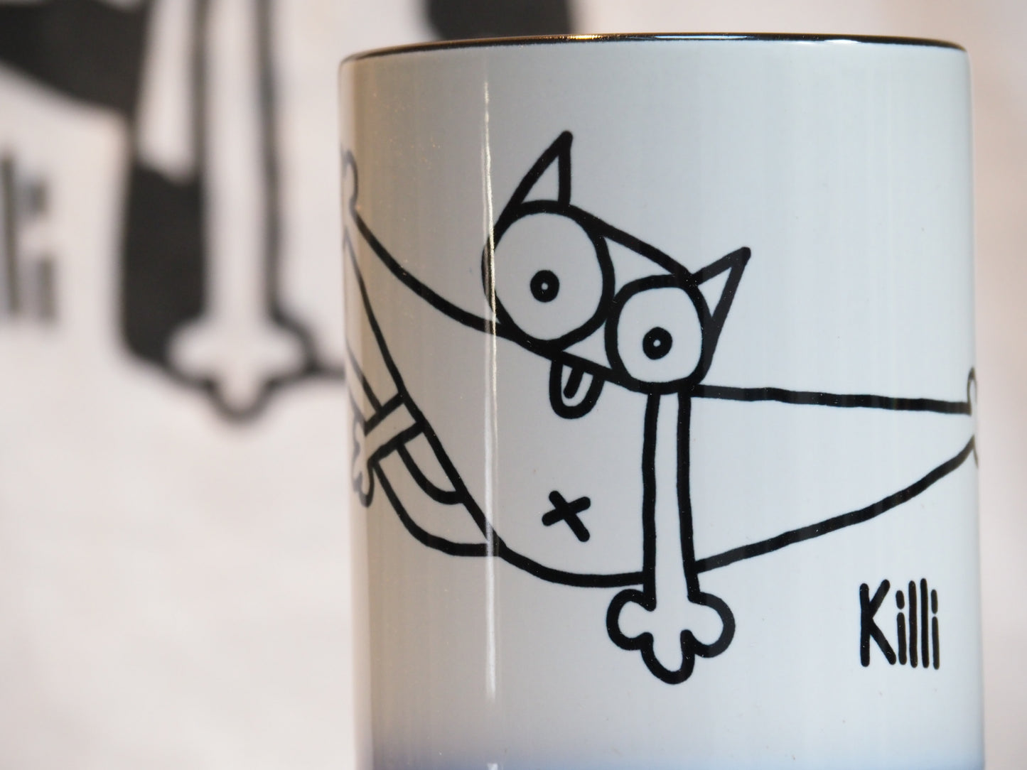 Mug self grooming cat black white doodle