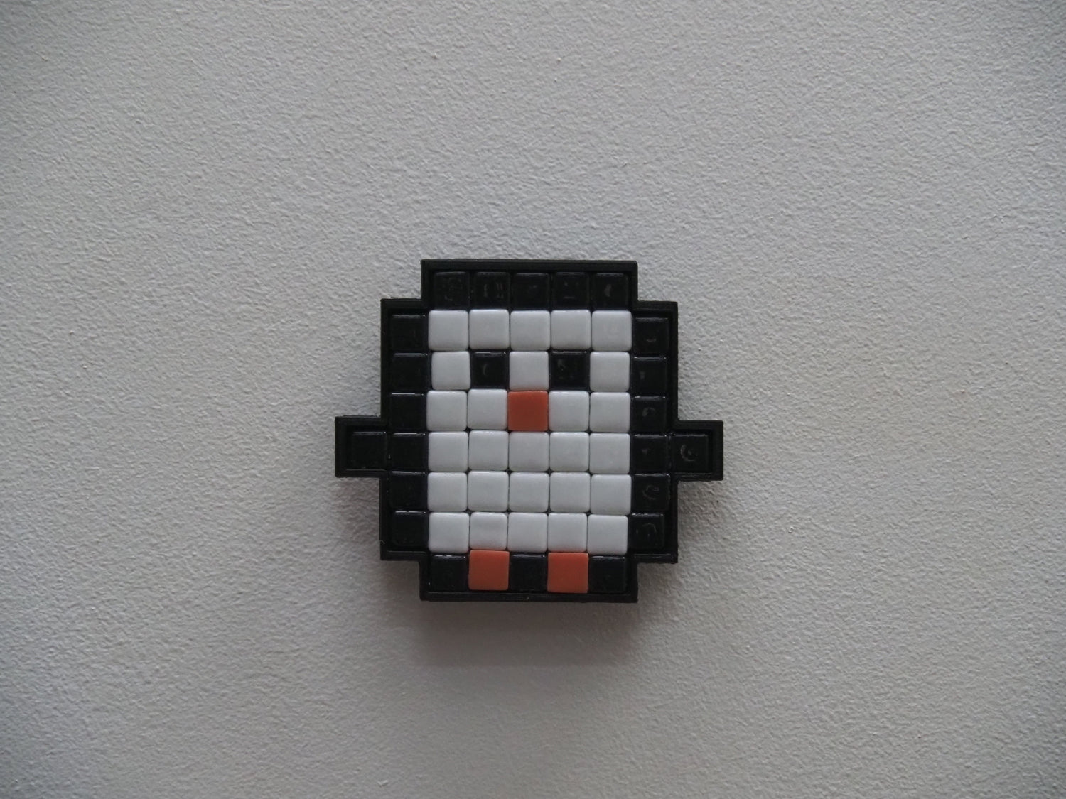 Pixelated penguin design on a white background