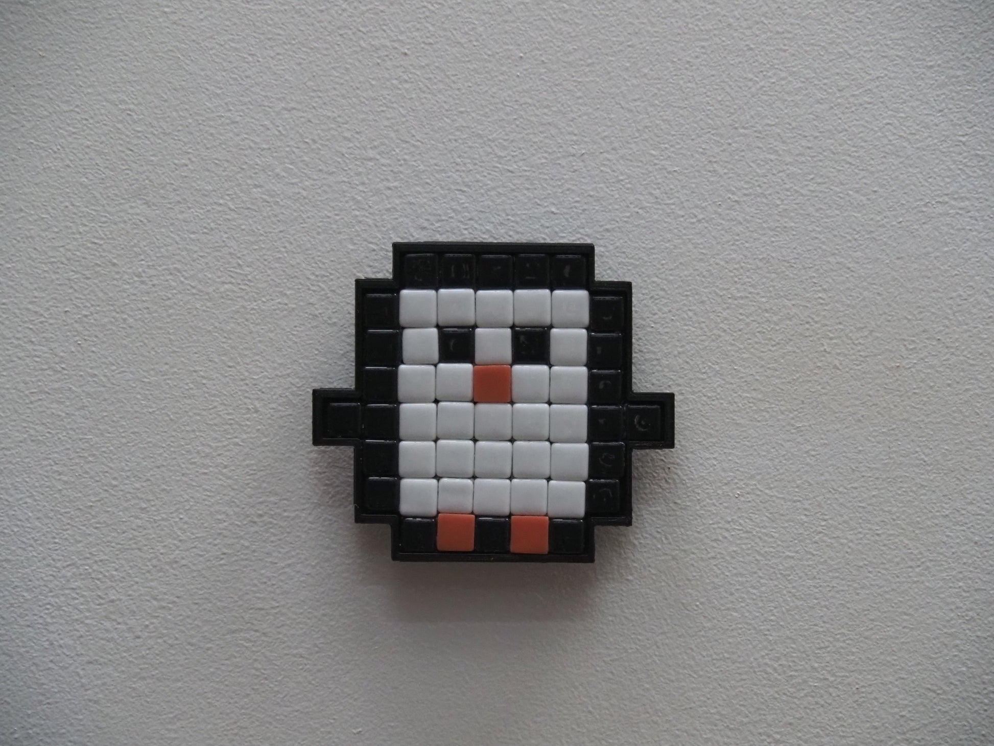 Pixelated penguin design on a white background