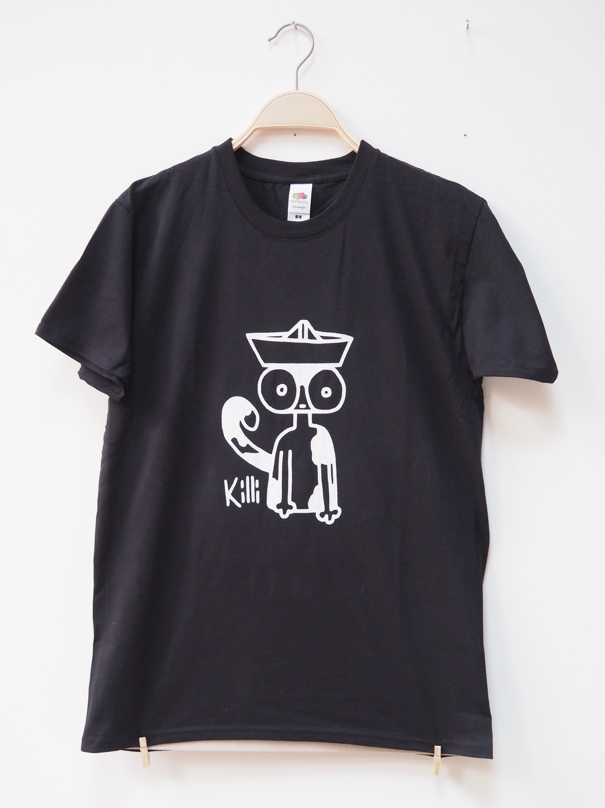Black t-shirt with a white graphic design of a cat wearing a paper hat on a white background