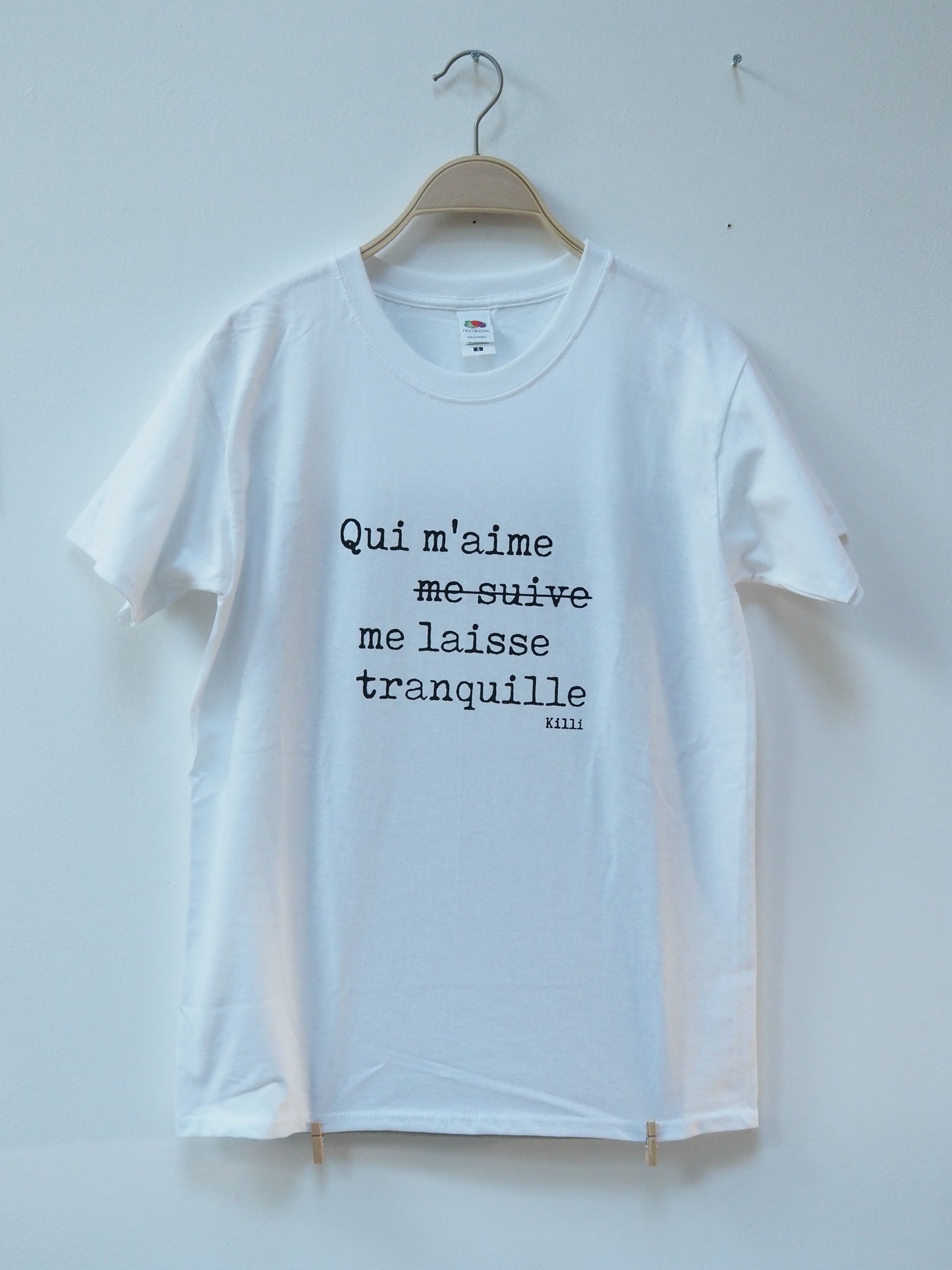 White t-shirt with black text on a white background